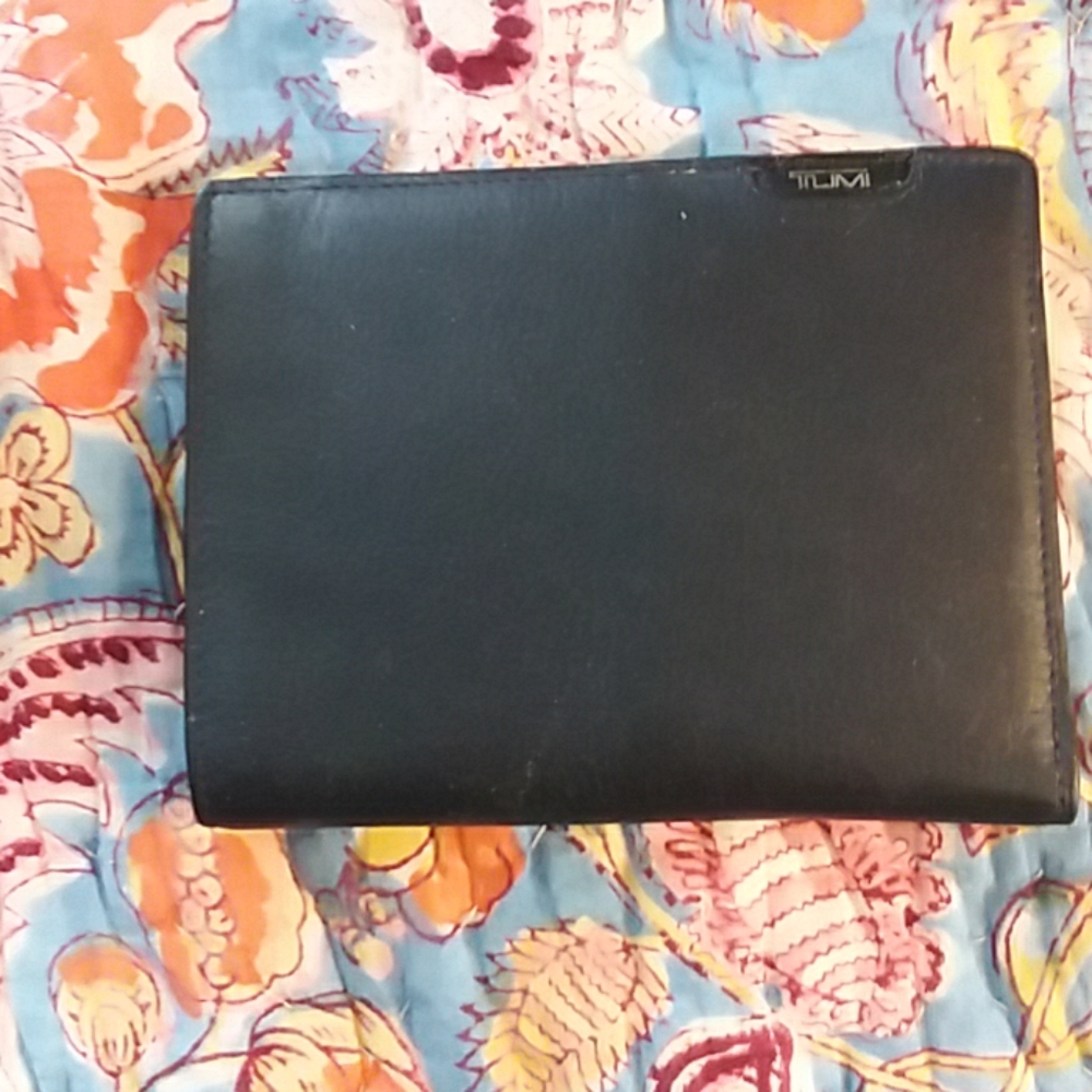 Black leather tumi passport holder